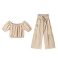 High-waisted Solid-color Flared Pants With Tie Detailing And A Flowing Drape