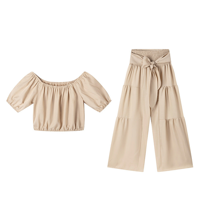 High-waisted Solid-color Flared Pants With Tie Detailing And A Flowing Drape