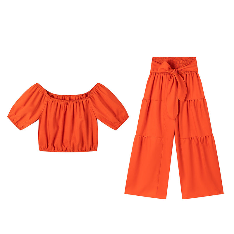 High-waisted Solid-color Flared Pants With Tie Detailing And A Flowing Drape