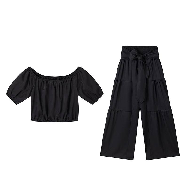 High-waisted Solid-color Flared Pants With Tie Detailing And A Flowing Drape