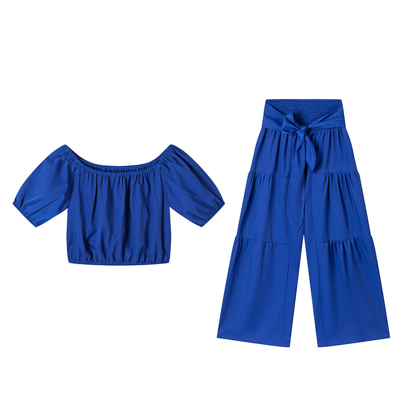 High-waisted Solid-color Flared Pants With Tie Detailing And A Flowing Drape
