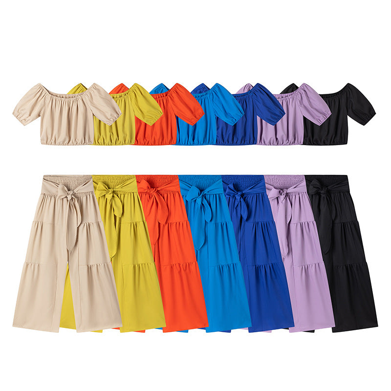 High-waisted Solid-color Flared Pants With Tie Detailing And A Flowing Drape