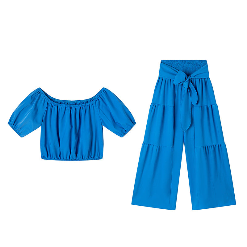 High-waisted Solid-color Flared Pants With Tie Detailing And A Flowing Drape